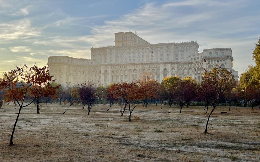 An autumn photo of the building that looks ghostly with the setting sun